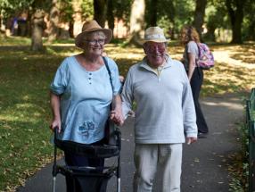 Woman and man waling in park