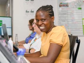 Lady sitting at desk and smiling